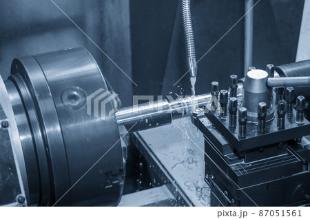 The lathe machine cutting  the metal  shaft parts with water base coolant method. The lathe machine cutting  the metal  shaft parts with water base coolant method. 87051561