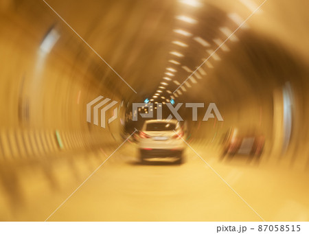 White jeep rides through a large tunnel blurred swirl effect. Russia Sochi 08 04 2019 87058515