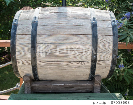 Wooden barrel of light dry wood on street 87058608