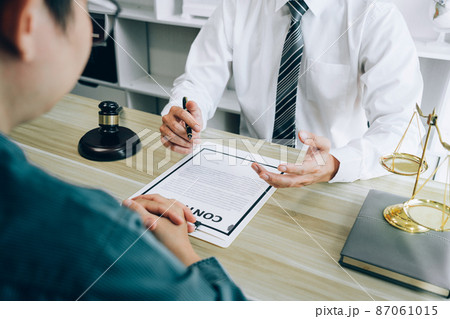 Male lawyer counselor are meeting with client to discuss consultation with litigation contract papers document of estate working in workplace, Law and Legal services concept Male lawyer counselor are meeting with client to discuss consultation with litigation contract papers document of estate working in workplace, Law and Legal services concept 87061015