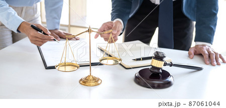 Consultation and conference of professional businesswoman and Male lawyers working and discussion having at law firm in office. Concepts of law, Judge gavel with scales of justice Consultation and conference of professional businesswoman and Male lawyers working and discussion having at law firm in office. Concepts of law, Judge gavel with scales of justice 87061044