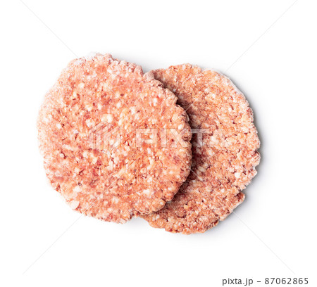 Frozen hamburger meat. Raw beef patties isolated on white background. Frozen hamburger meat. Raw beef patties isolated on white background. 87062865