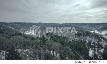 Only the green in winter hills 87063407