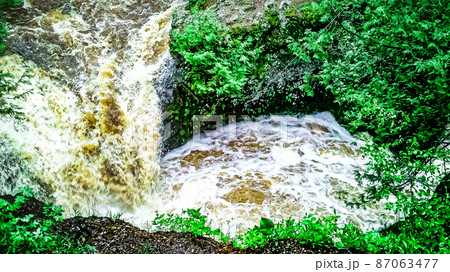 Natural waterfalls in nature with vibrant trees Natural waterfalls in nature with vibrant trees 87063477