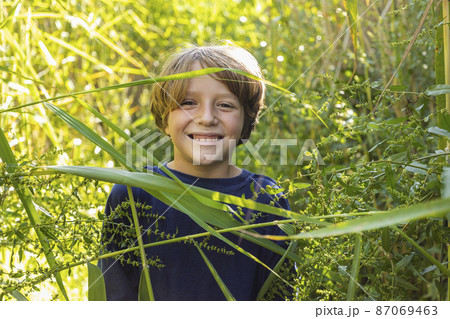 Outdoor portrait of happy boy 87069463