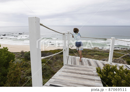 South Africa, Western Cape, Boy (8-9) looking at ocean view in Lekkerwater Nature Reserve South Africa, Western Cape, Boy (8-9) looking at ocean view in Lekkerwater Nature Reserve 87069511