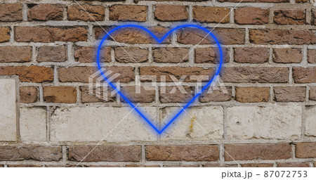 Image of glowing neon heart icon on brick wall Image of glowing neon heart icon on brick wall 87072753