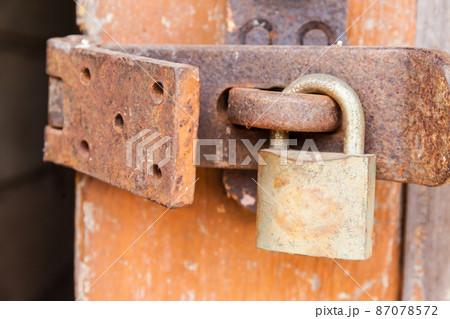 Rusty Key To The Wooden Door 87078572
