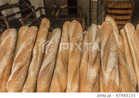 Fresh baked goods bakery loaf baguette bread background 87083133