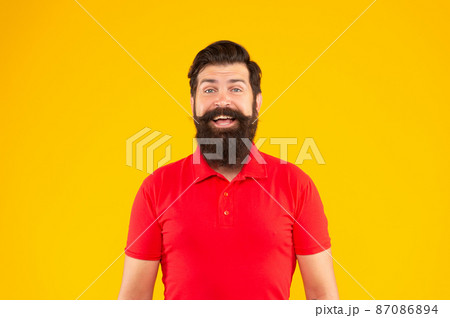 happy hipster male with beard on yellow background, face happy hipster male with beard on yellow background, face 87086894