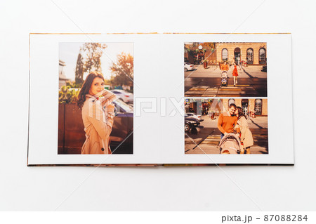 pages of a photobook from a family photo shoot.  87088284