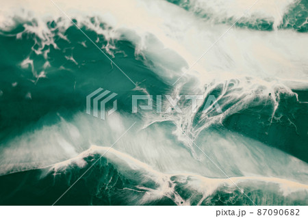 Green and white abstract marble texture ocean foamy waves 87090682