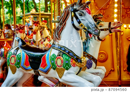 Horse carousel at amusement park 87094560