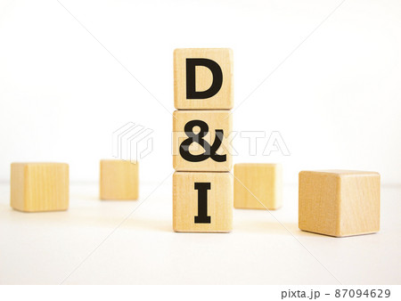 D and I, Diversity and inclusion symbol. Concept words D and I, diversity and inclusion on wooden cubes on beautiful white table, white background. Business, D and I, diversity and inclusion concept. 87094629