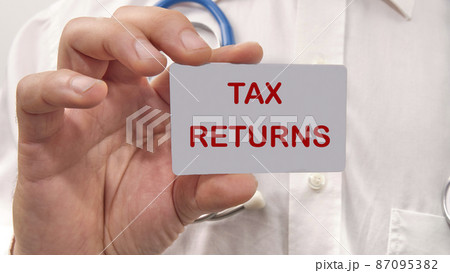 tax returns the text on the card in the man's hand 87095382