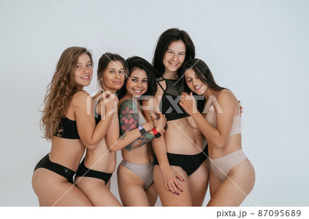 diverse models wearing comfortable underwear, enjoying time together 87095689