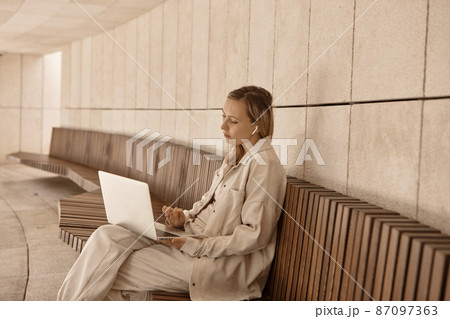 A young woman answers a video call.  87097363