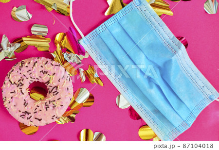 colorful gift boxes with medical mask and donut 87104018