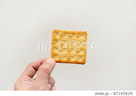 biscuits on you hand white background. biscuits on you hand white background. 87105620