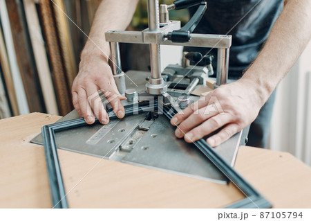 Framing Workshop. Making staples corners brackets baguette handmade picture frame at studio. Framing Workshop. Making staples corners brackets baguette handmade picture frame at studio. 87105794