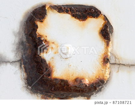 A thoroughly rusted bolt, with peeling, flaky paintwork. A thoroughly rusted bolt, with peeling, flaky paintwork. 87108721