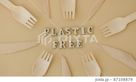 PLASTIC FREE text around Eco friendly, disposable, recyclable, compostable tableware. Paper food boxes, dishes on neutral beige background. Sustainable lifestyle concept. Flat lay 87108879