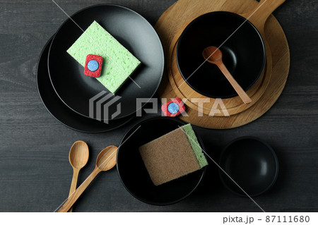 Concept of Dishwashing detergent accessories on dark wooden table Concept of Dishwashing detergent accessories on dark wooden table 87111680
