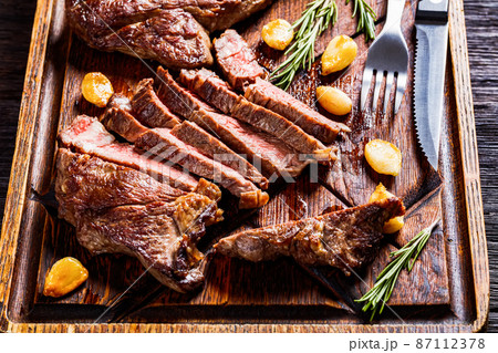 fried juicy chuck eye beef steaks, top view 87112378