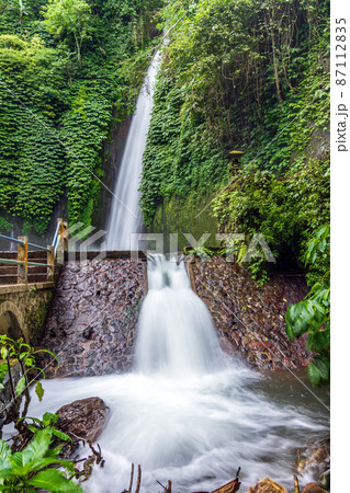 Big waterfall in rainforest at Bali, Indonesia Big waterfall in rainforest at Bali, Indonesia 87112835