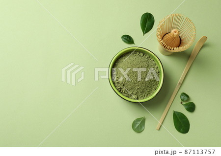 Concept of japanese tea with matcha on green background Concept of japanese tea with matcha on green background 87113757