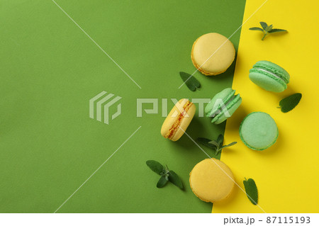 Concept of tasty dessert with macarons on two tone background 87115193