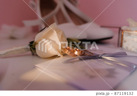 Bride's accessories. Gold wedding rings, boutonniere of the groom, for the bride, wedding invitation Bride's accessories. Gold wedding rings, boutonniere of the groom, for the bride, wedding invitation 87119132