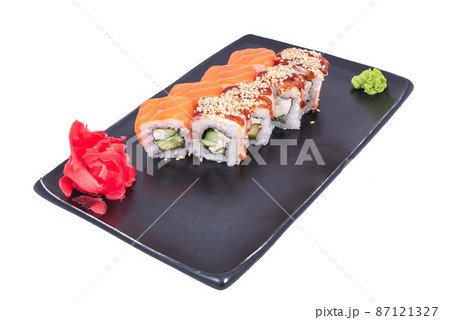 Japanese seafood Sushi roll isolated on white close up. Japanese food restaurant, sushi maki gunkan roll plate or platter set. Maki Sushi rolls with salmon and avocado. Sushi isolated at white 87121327