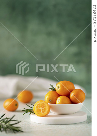 large ripe juicy kumquat fruits in a white bowl large ripe juicy kumquat fruits in a white bowl 87123423