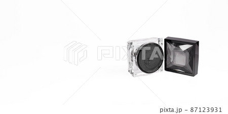 Black magnetic face mask with a piece of black magnet in the jar. Black magnetic face mask with a piece of black magnet in the jar. 87123931
