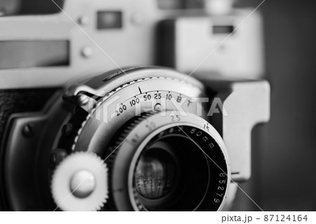Vintage old photography film camera with lens. Close up macro shot 87124164