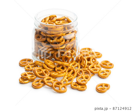 Mini pretzels. Crusty salted snack isolated on white background. Mini pretzels. Crusty salted snack isolated on white background. 87124912