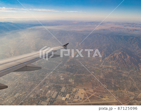 Aerial view of San Bernardino Mountains, view from window seat in an airplane 87125096
