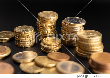 Background of Euro coins on black background. Currency Money Background of Euro coins on black background. Currency Money 87125286