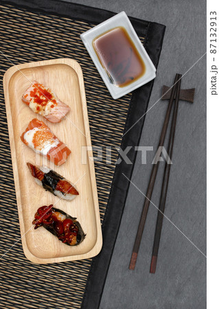 Sushi set on plate with chopsticks and sauce. Top view. 87132913
