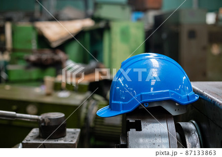Blue helmet or hard hat for head safety in industry factory. equipment safe of worker construction. Blue helmet or hard hat for head safety in industry factory. equipment safe of worker construction. 87133863