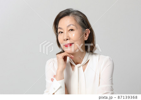Asian Korean senior woman, bold and red cosmetics makeup beauty concept in studio 87139368