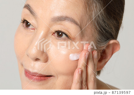 Asian Korean senior woman, basic skin care beauty concept in studio 87139597