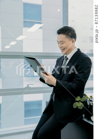 business concept asian korean man, examining the paper 87139982