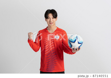 soccer football sports player, asian korean man with motions in studio background 87140551
