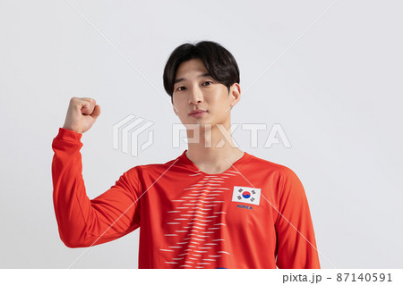 soccer football sports player, asian korean man with motions in studio background 87140591