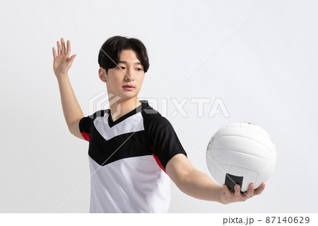 volleyball sports player, asian korean man preparing serve, serving the ball volleyball sports player, asian korean man preparing serve, serving the ball 87140629