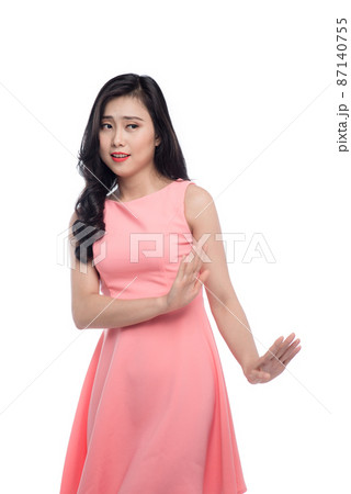 Young asian woman gesture annoyed isolated on white. Young asian woman gesture annoyed isolated on white. 87140755