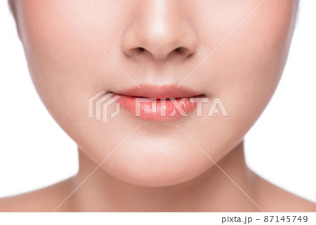 Young asian woman close up. Perfect natural lip makeup Young asian woman close up. Perfect natural lip makeup 87145749