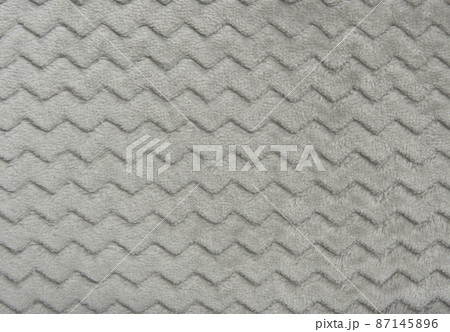 gray fleece blanket. fragment of drawing and fabric texture gray fleece blanket. fragment of drawing and fabric texture 87145896